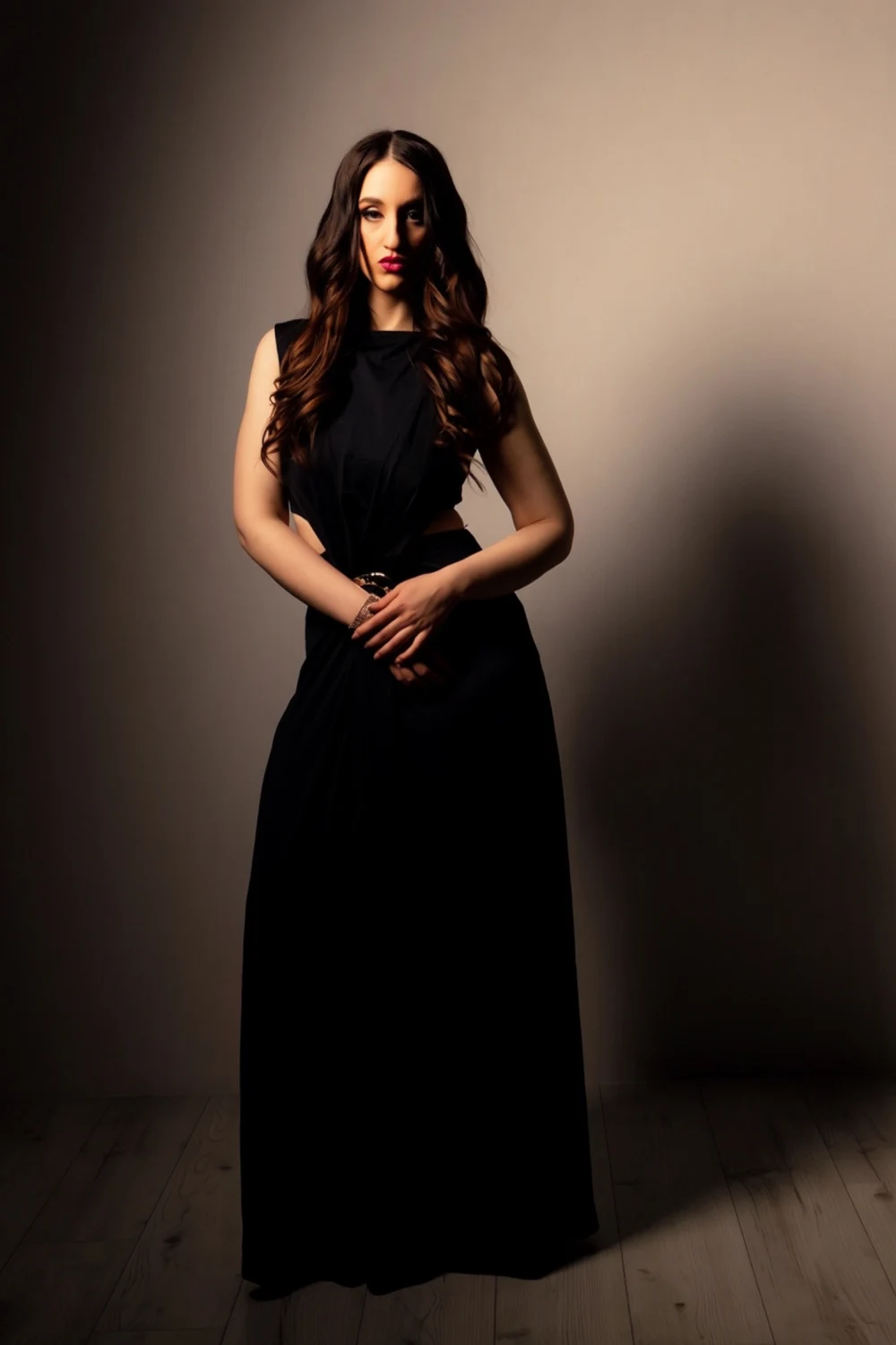 Nishka standing in a long black dress