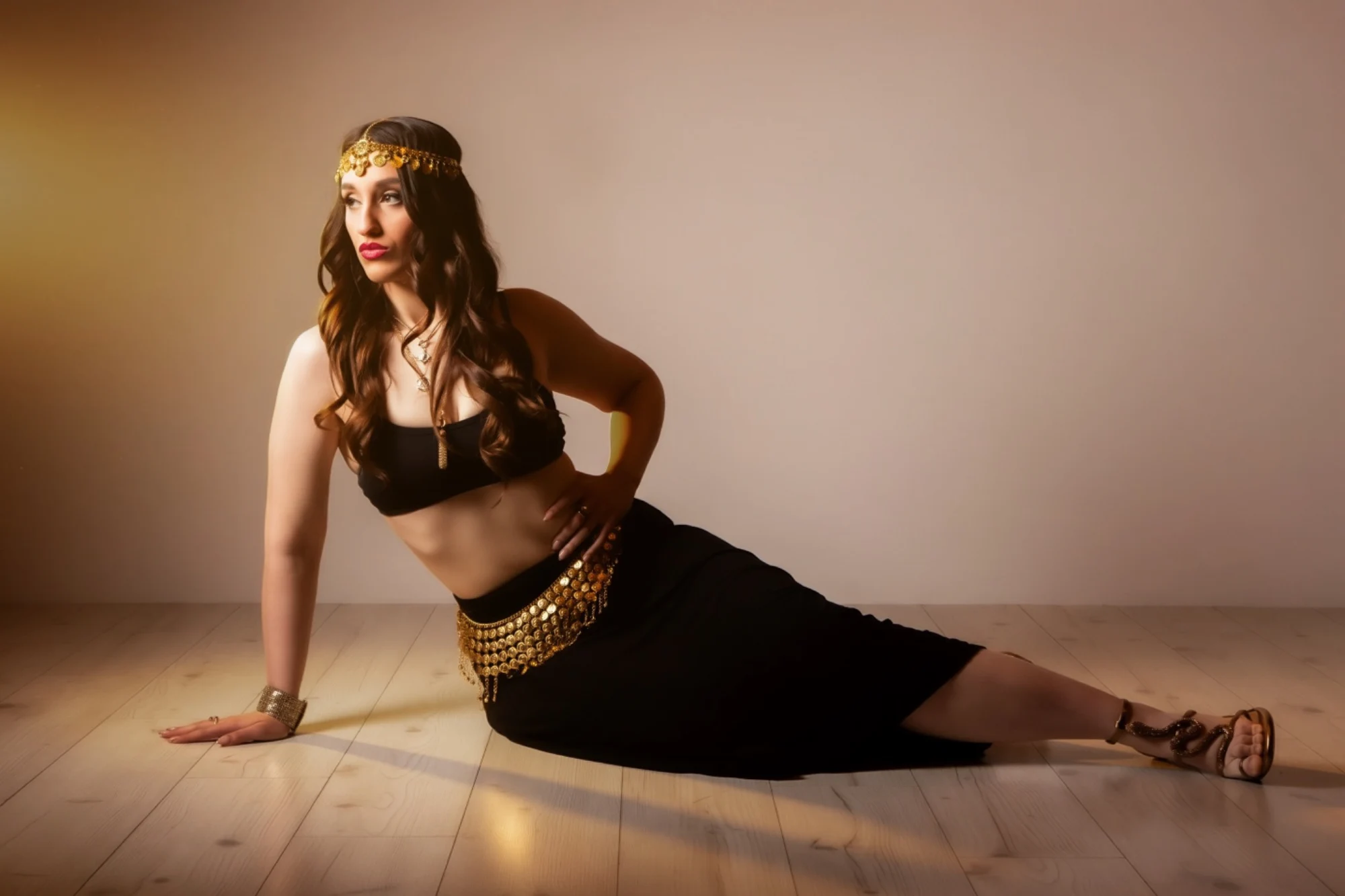 Nishka reclining in black and gold