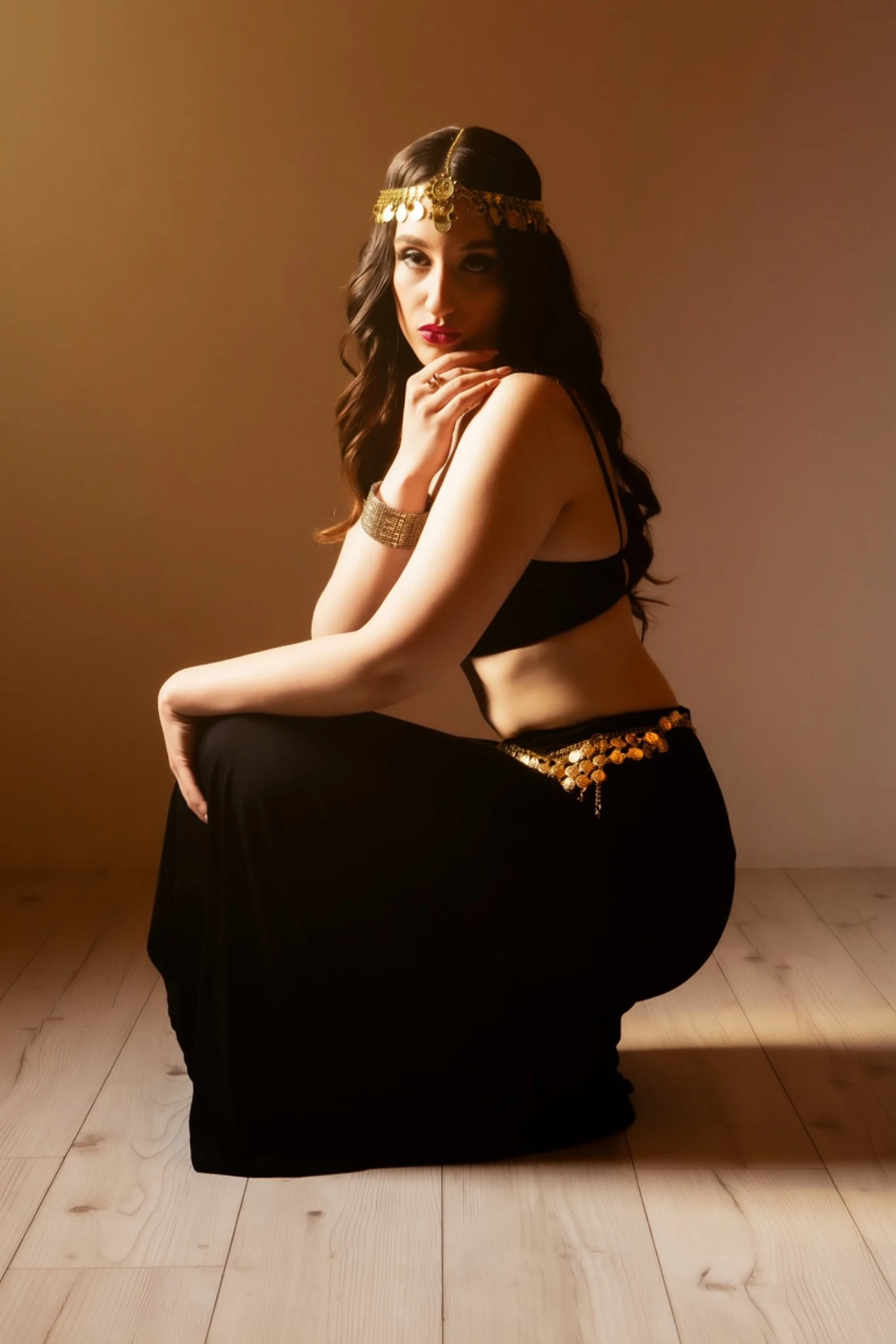 Alternate seated portrait of Nishka with a gold headband
